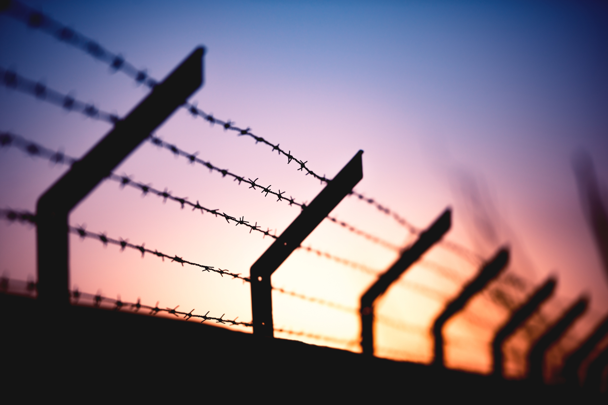 legal news around prisons barbed wire fence