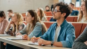 Students in university classroom listening to lecture about employability 