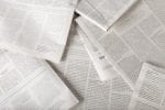 Newspapers spread out on a surface