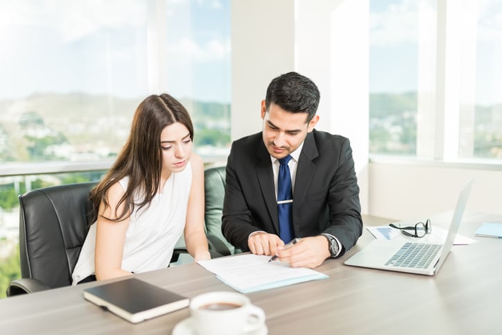 legal professional advising a client in his office