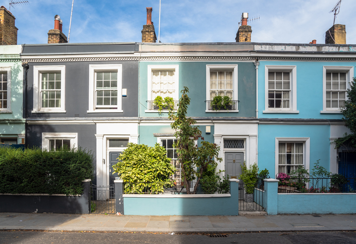 Row of terraced houses in different shades of blue