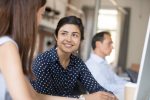 Young female trainee talking to a mentor