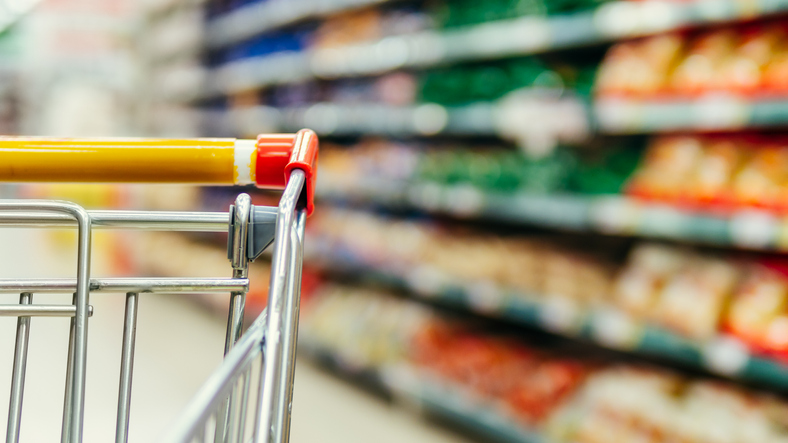 Supermarket aisles and close up of a trolley