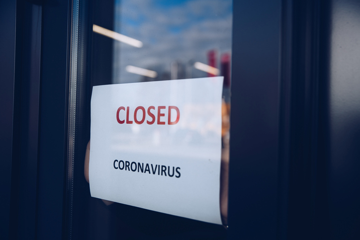 "Closed" sign in a shop window