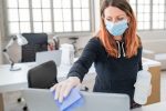 Woman cleaning her computer