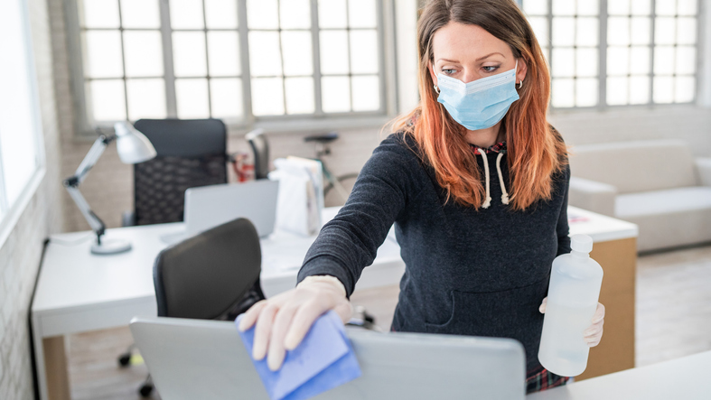 Woman cleaning her computer