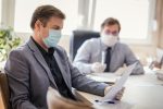 Business men wearing face masks