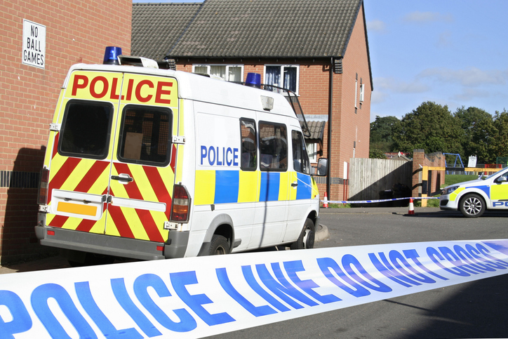 Police van parked outside a residential building