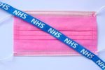 Surgical mask with NHS lanyard on top