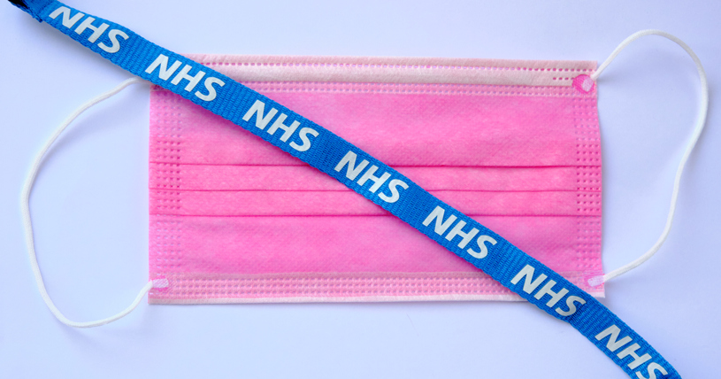 Surgical mask with NHS lanyard on top